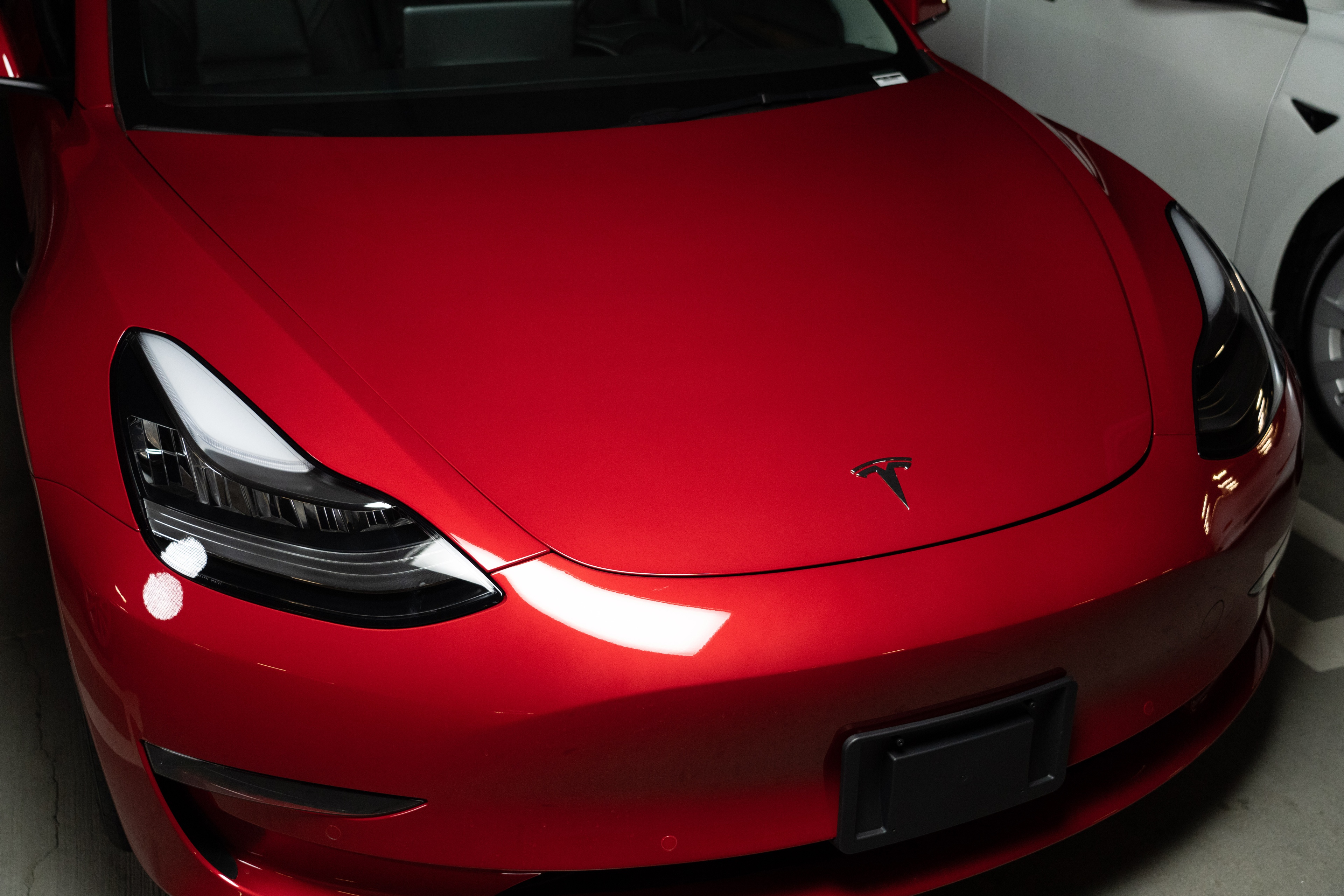 Front of a red Tesla Model 3